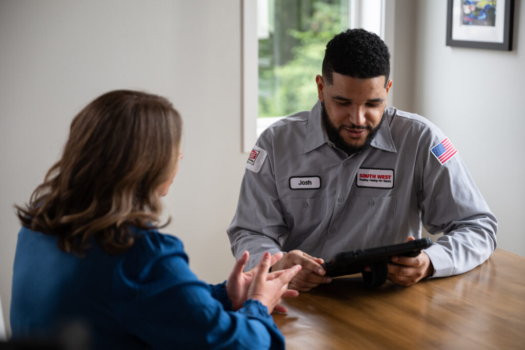 HVAC Tech working with Seattle customer.